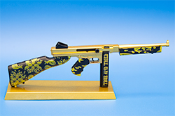 The gold and black TSMG model