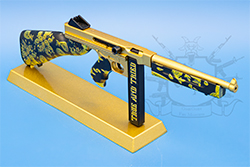 The gold and black TSMG model