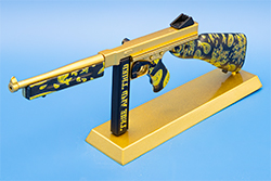 The gold and black TSMG model