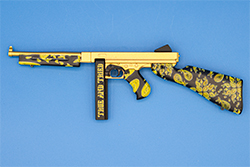 The gold and black TSMG model